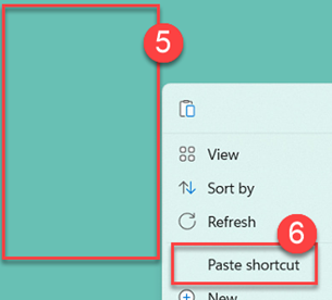 Right click and choosing paste shortcut from the menu